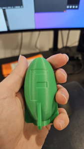 Green 3D Printed bomb with the letter F on it