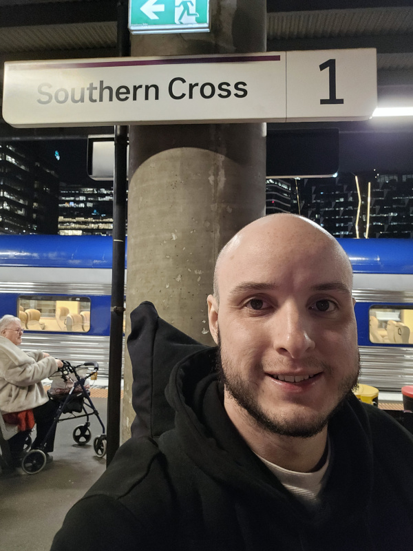 A photo of me in front of the Southern Cross platform 1 sign